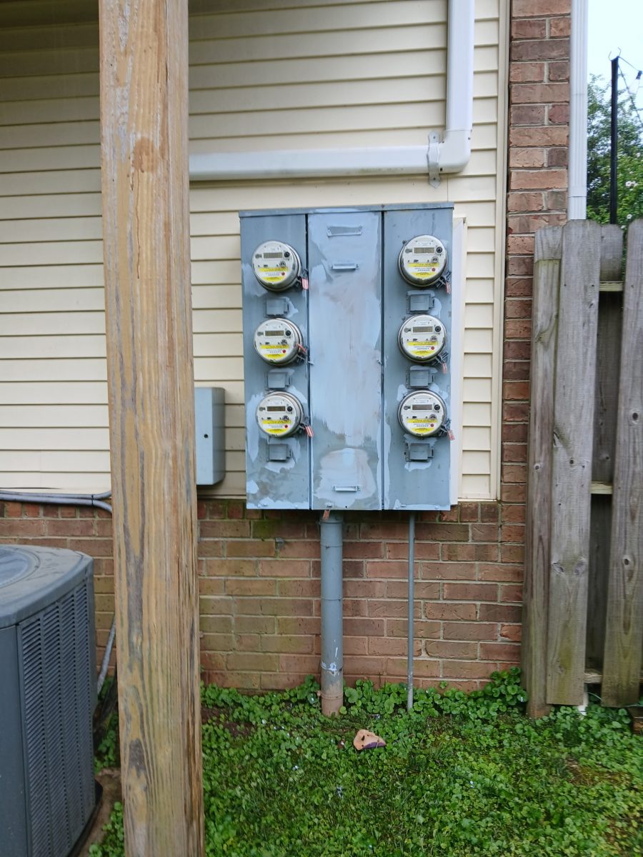 rusted electrical meter unit on side of building Preview Image 1