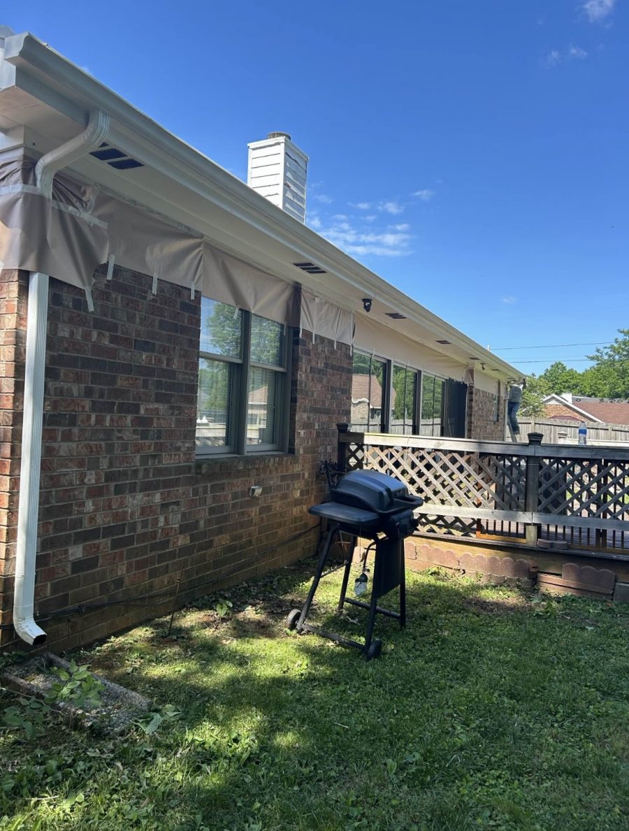 brick home in process of trim painting Preview Image 4