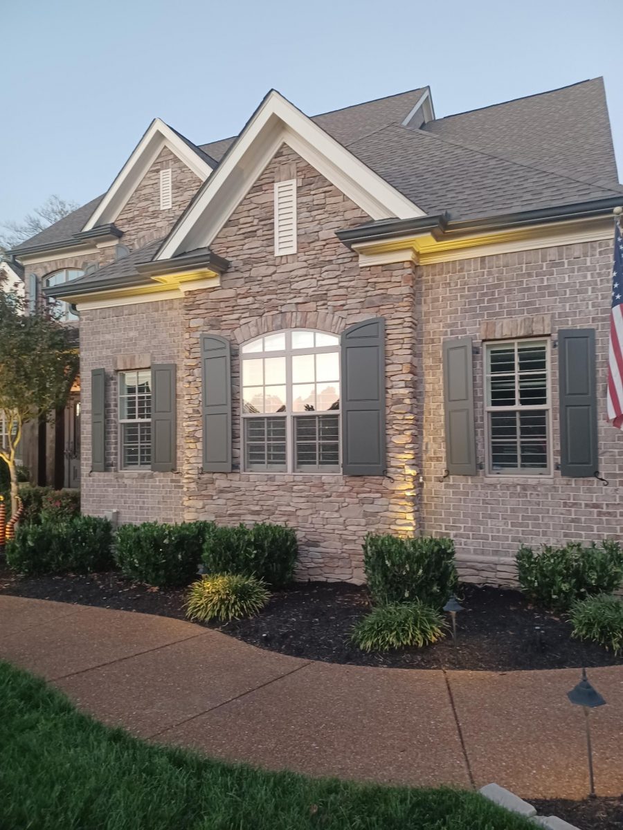 brick home with painted trim and shutters Preview Image 1