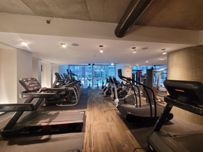 gym facility with rows of exercise equipment