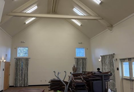 chairs and tables stacked in center of room