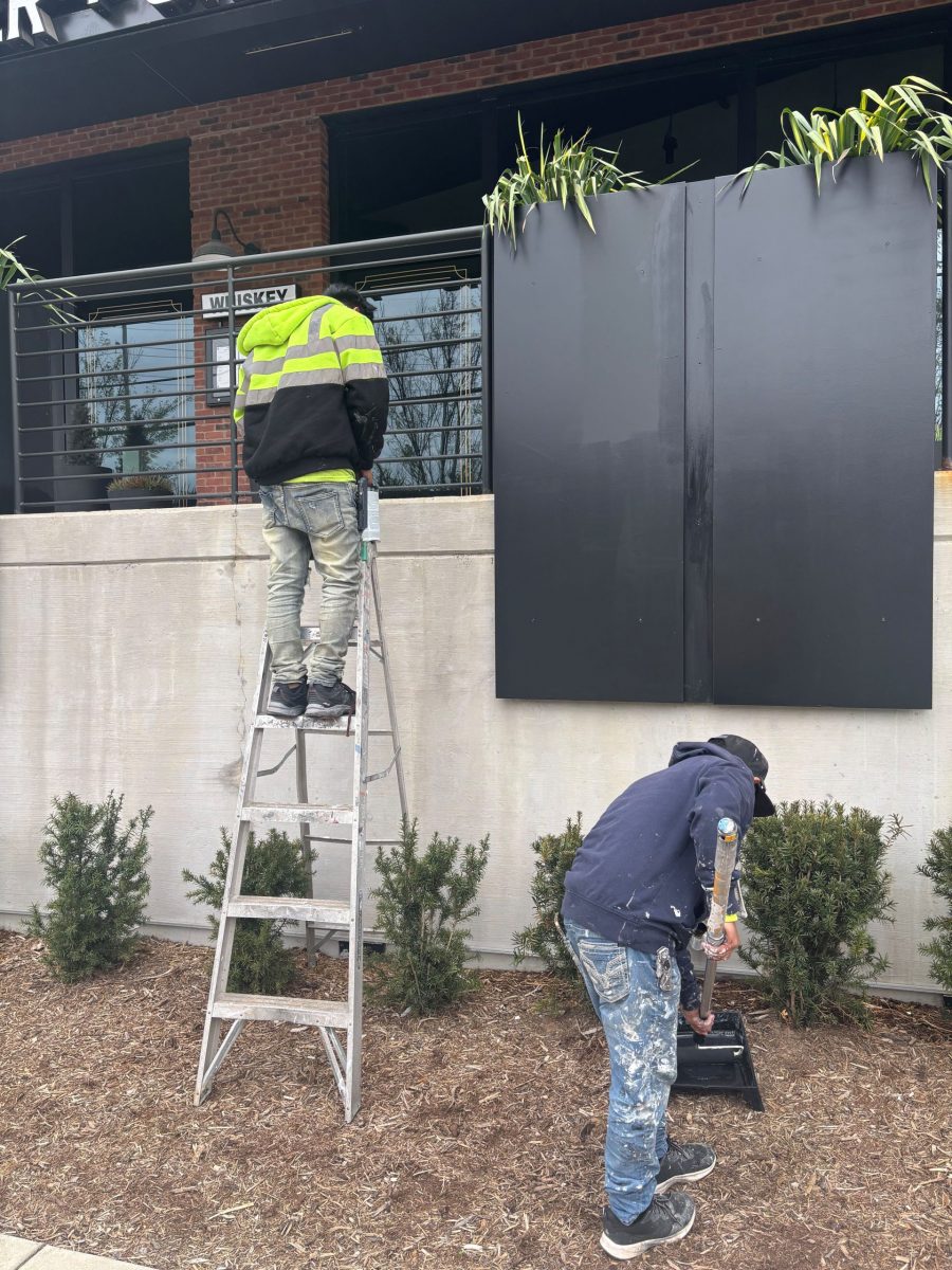 two painters working outside commercial building Preview Image 6