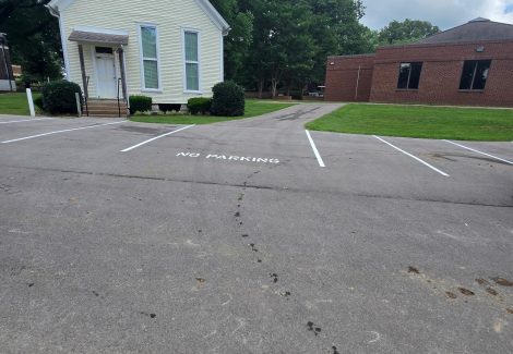 parking lot with repainted striping and space numbers