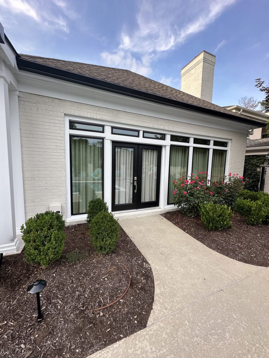 white house with black trim details around windows and door Preview Image 1