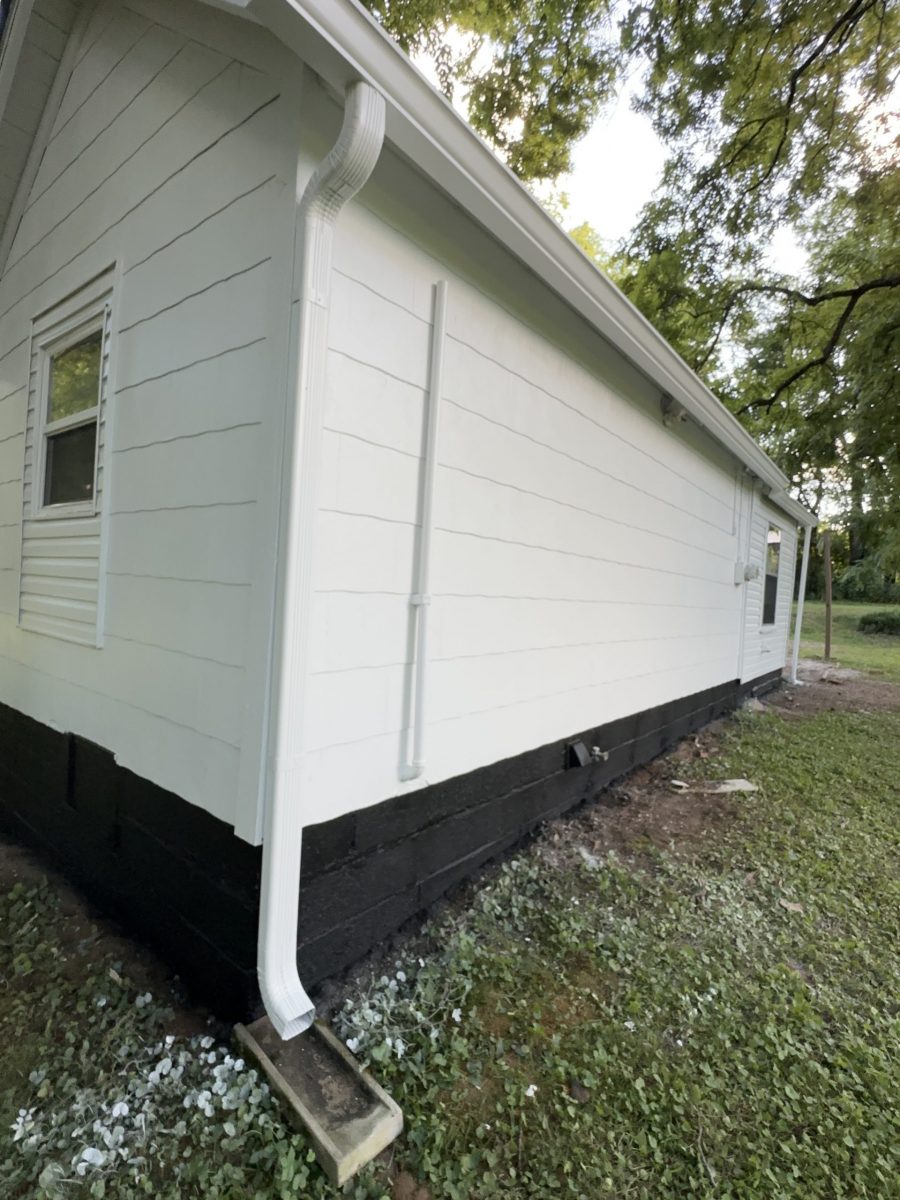 side of house with white siding and black shutters Preview Image 6