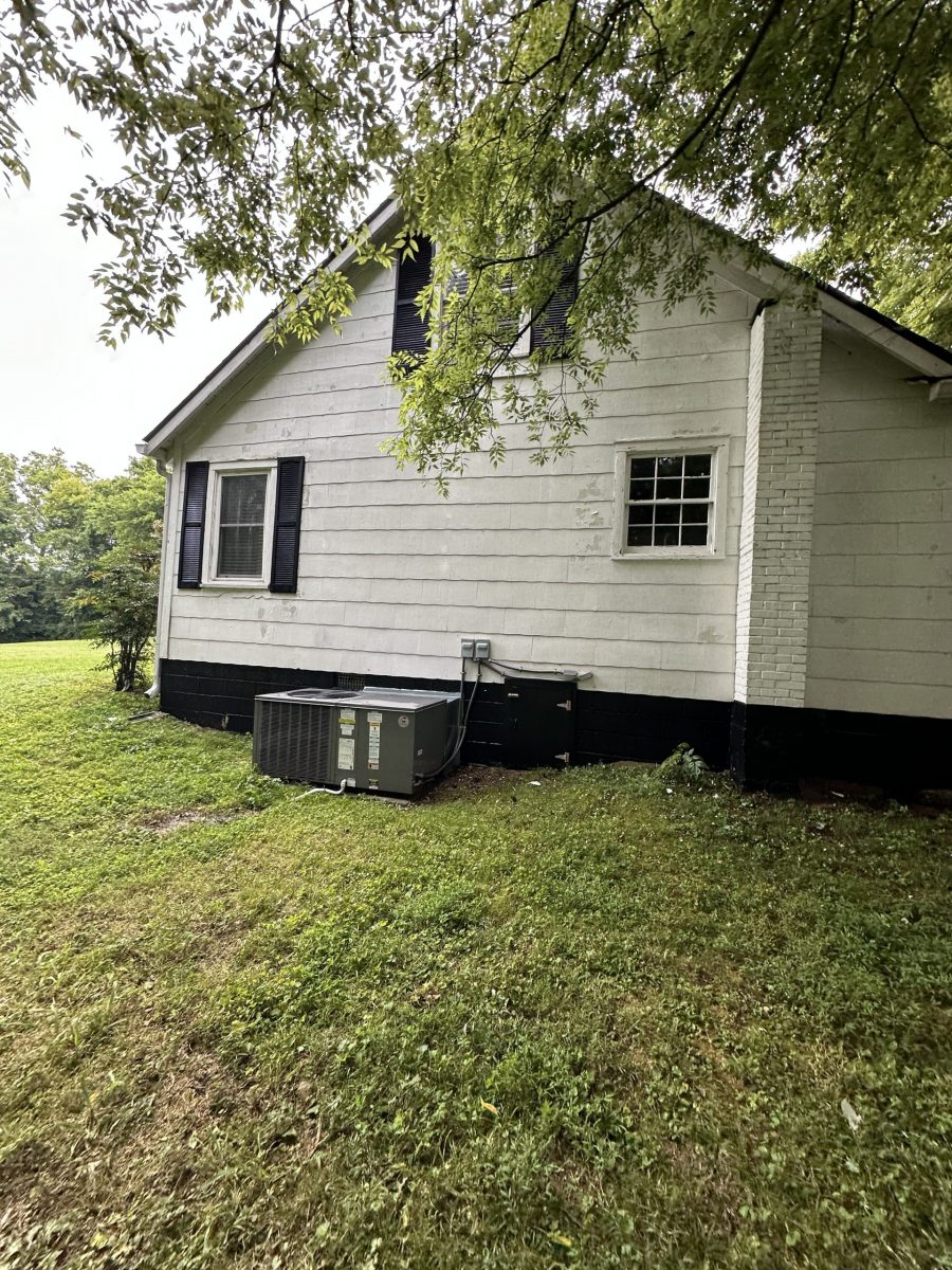 side of house with white siding and black shutters Preview Image 14