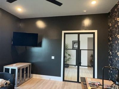 home office interior with black paint and wallpaper