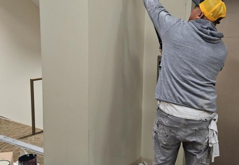 painter repairing drywall