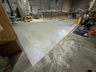 warehouse floor during epoxy coating installation