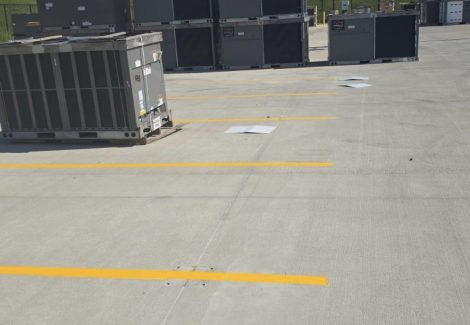 loading area lot with fresh painted striping and hvac equipment