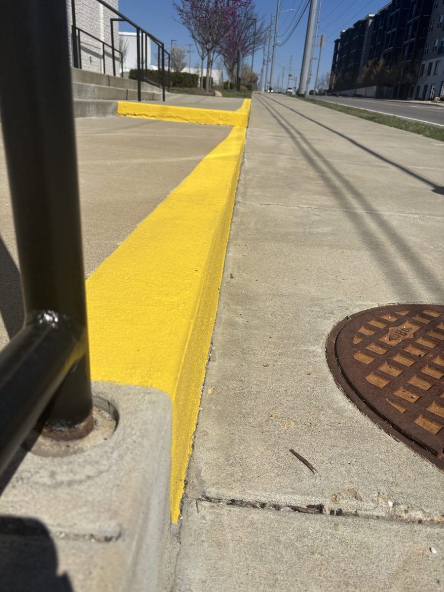 sidewalk with yellow safety paint on curb Preview Image 1