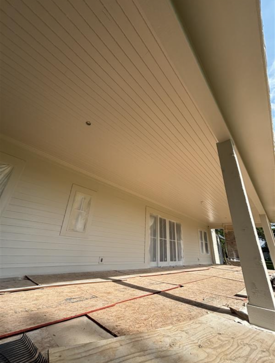 house with protective plastic during siding paint project Preview Image 4