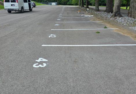 parking lot with repainted striping and space numbers