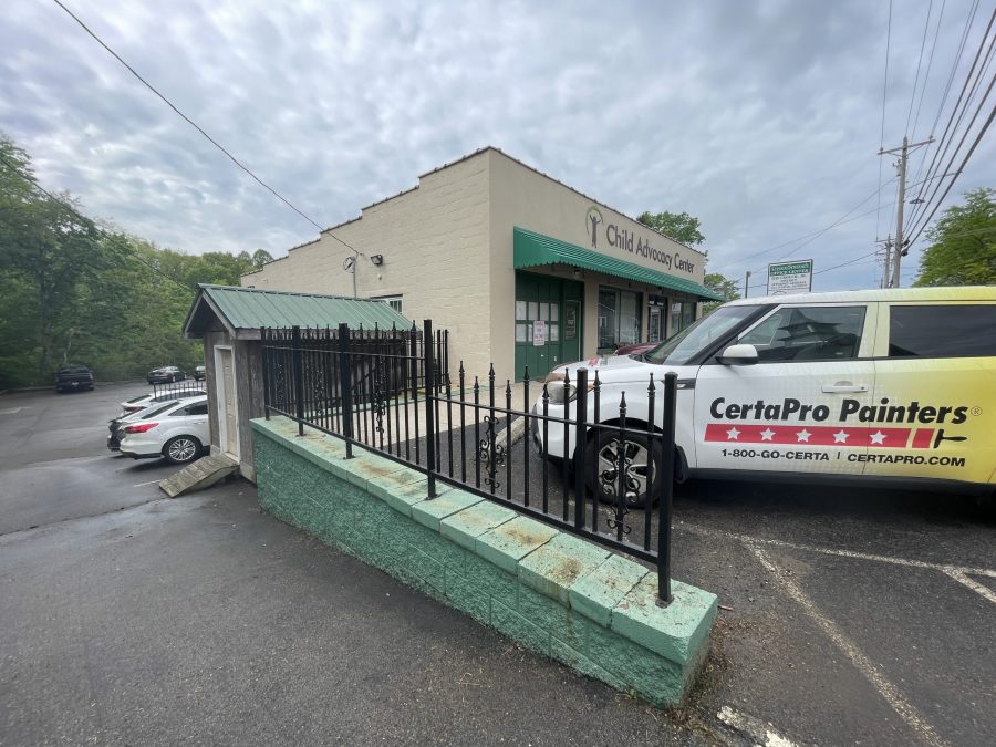 off-white and green commercial exterior before repaint Preview Image 8