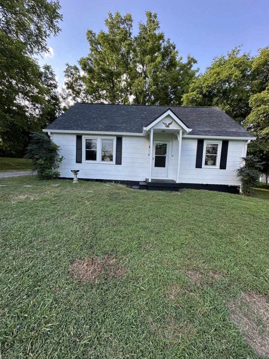 front of house with white siding and black shutters Preview Image 5