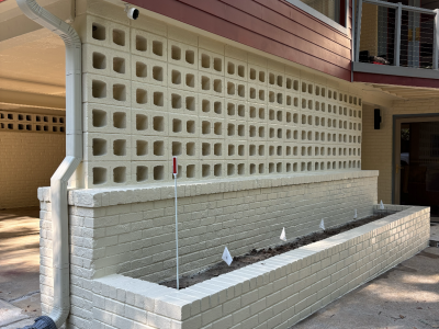 white painted brick garden wall