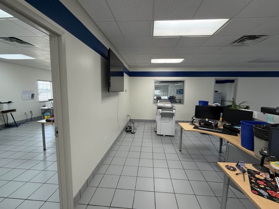car dealership interior with blue stripe paint on upper wall Preview Image 1