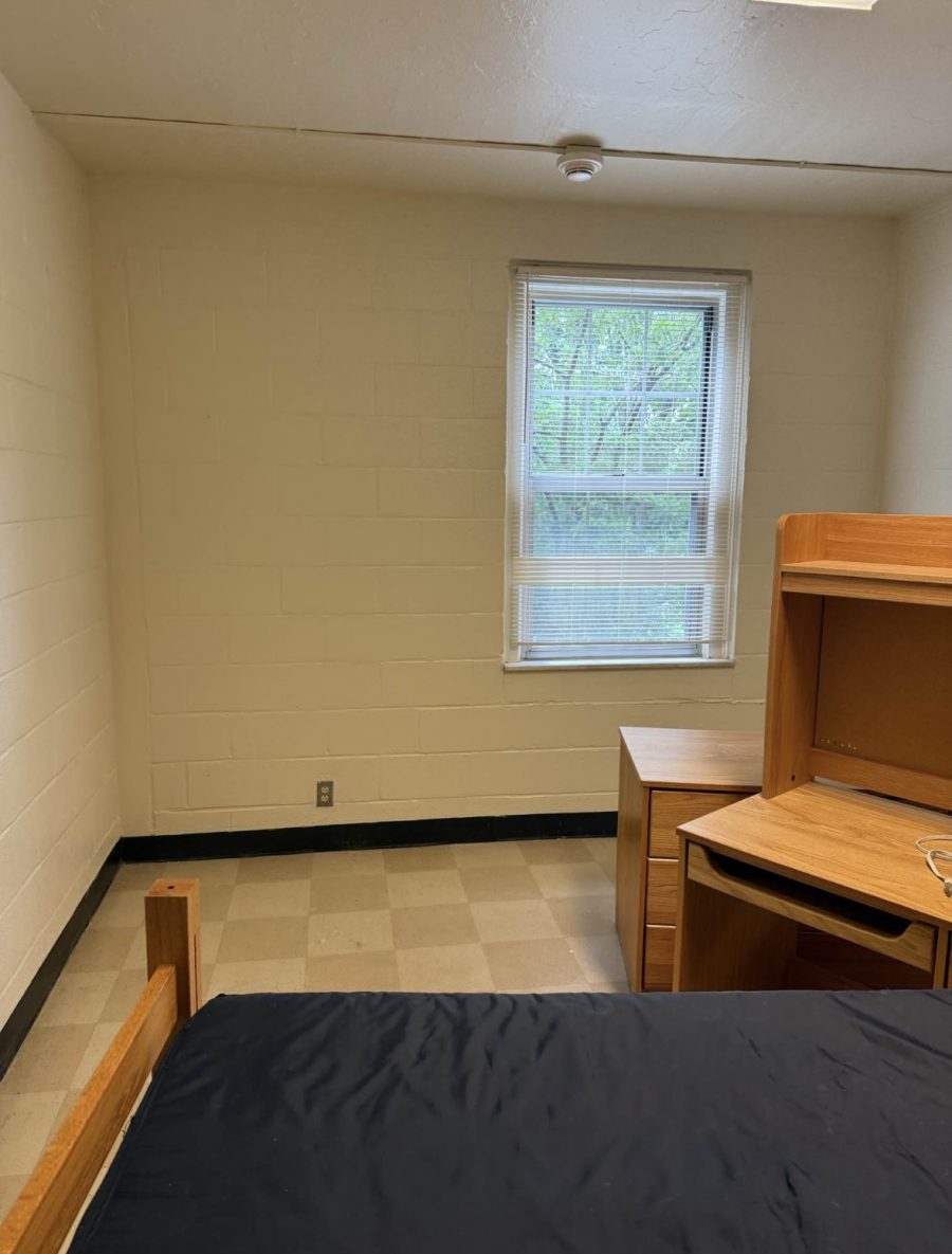 repainted dorm room with furniture pushed to center of room Preview Image 3