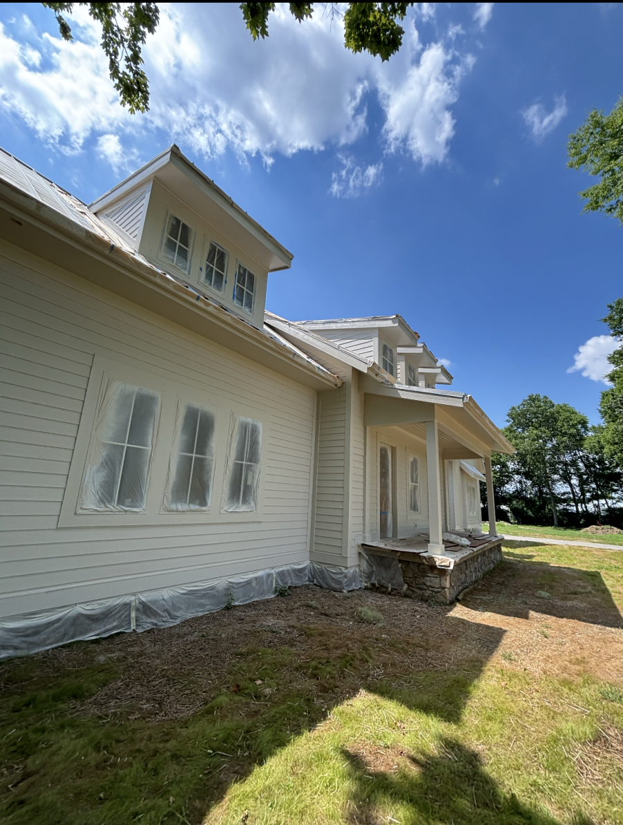 front of house during painting project with protective plastic sheeting Preview Image 6