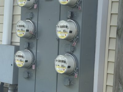 repainted electrical meter unit on side of building