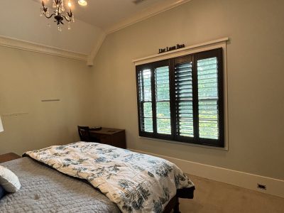 bedroom with light blue walls and white trim