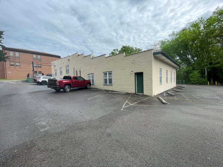 off-white and green commercial exterior before repaint Preview Image 10