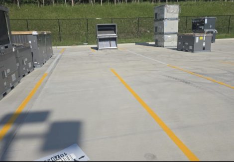 loading area lot with fresh painted striping and hvac equipment
