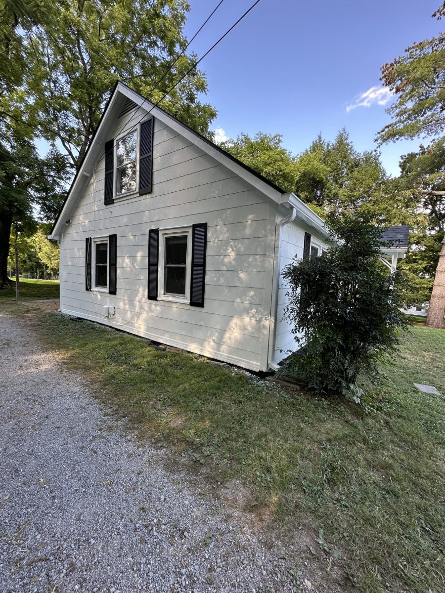 side of house with white siding and black shutters Preview Image 1