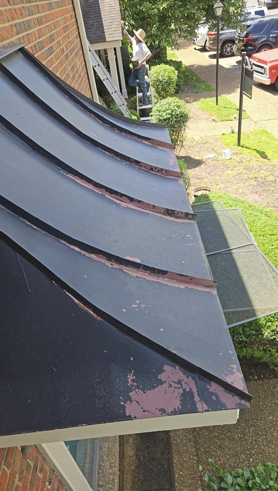 black metal awning with chipping paint Preview Image 1