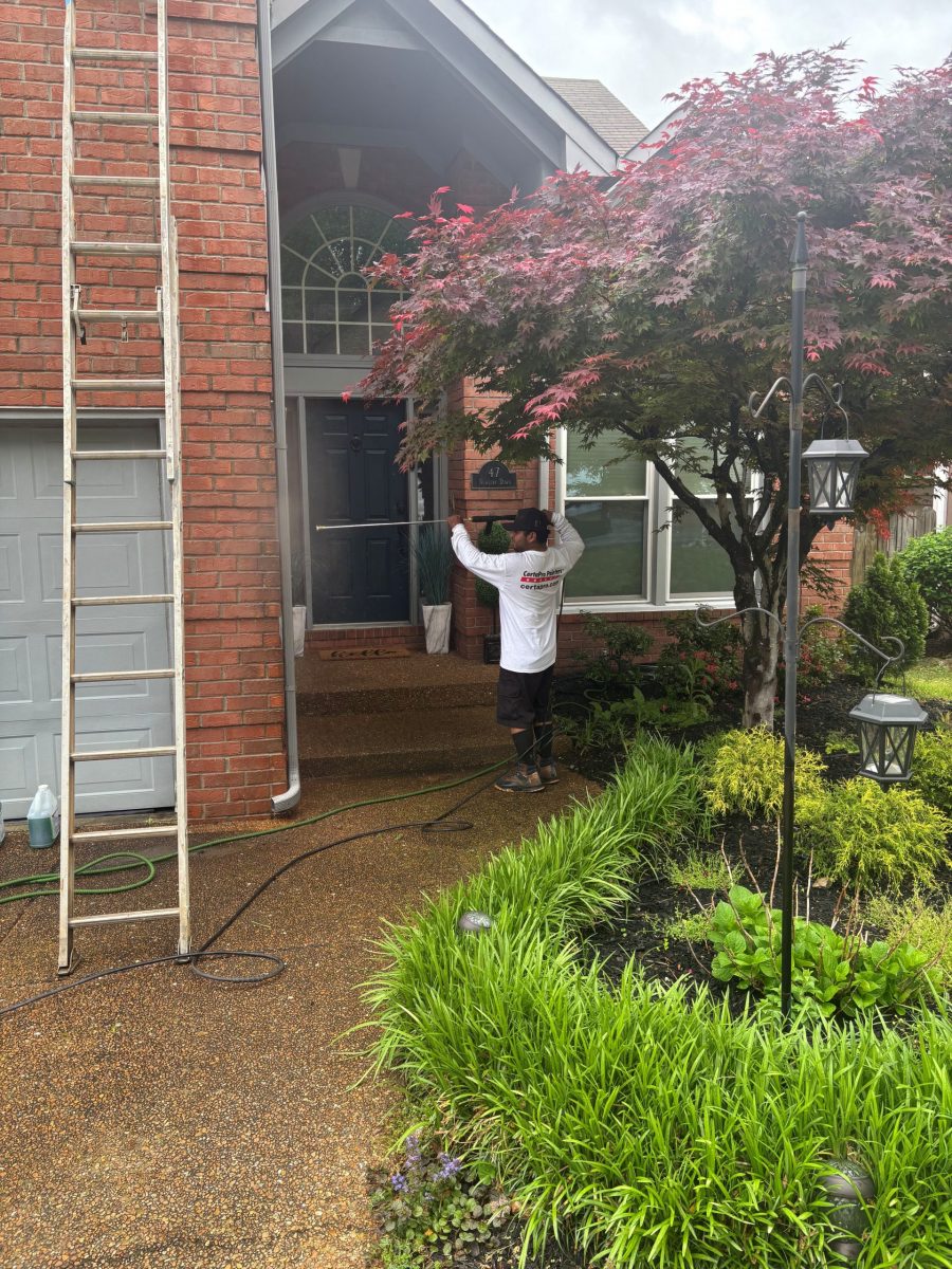 painters on ladders outside brick home Preview Image 2