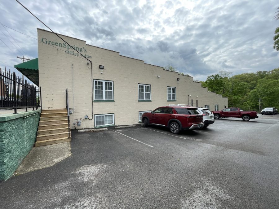 off-white and green commercial exterior before repaint Preview Image 5