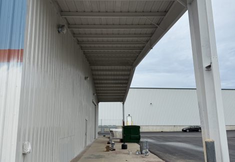 warehouse exterior with worn paint