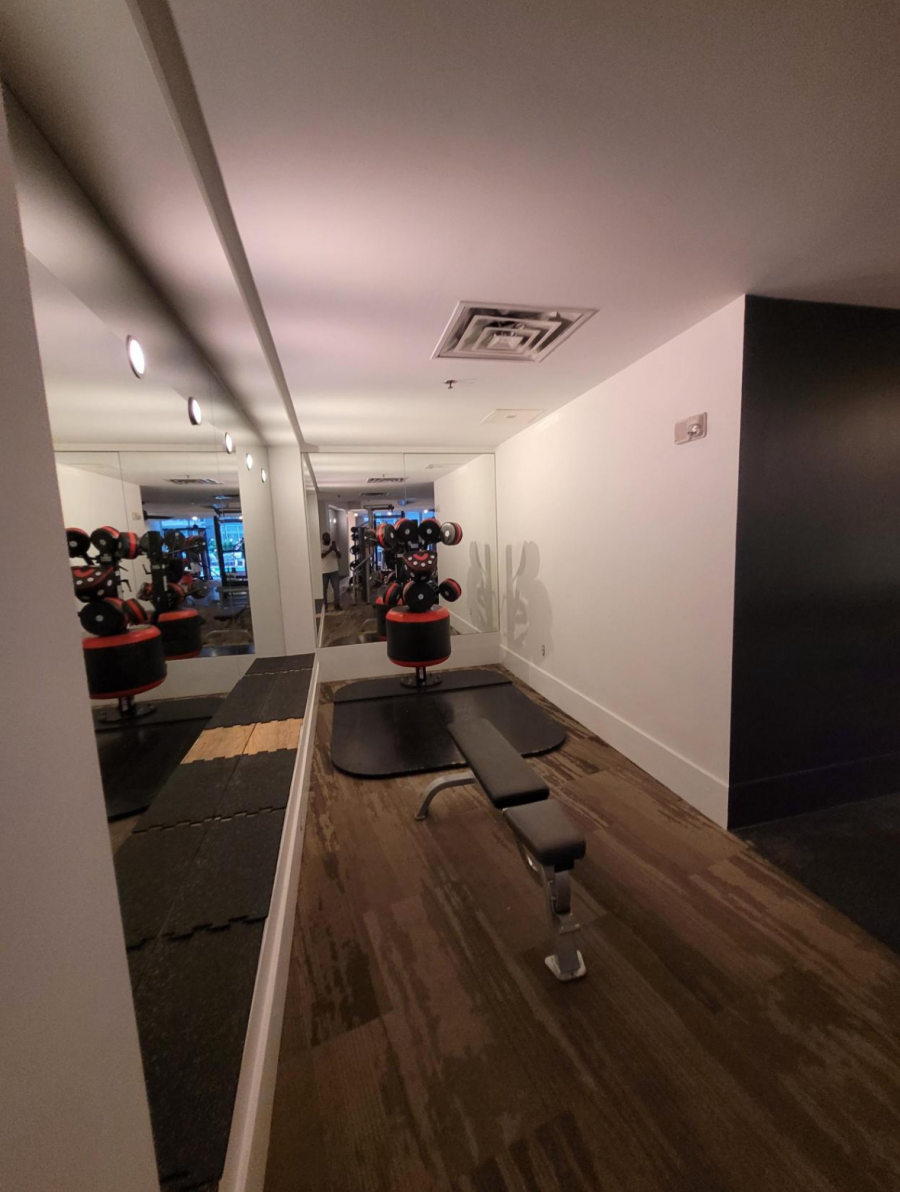 weight bench and mirror wall in gym Preview Image 3