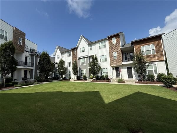 HOA townhouses with stained wooden siding Preview Image 1