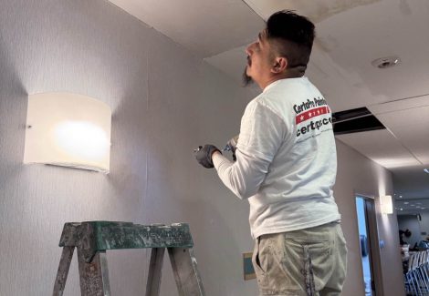 painter durin drywall repair project