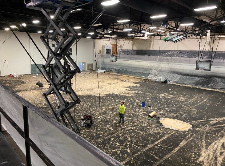 painters working in gymnasium with scissor lift Preview Image 5