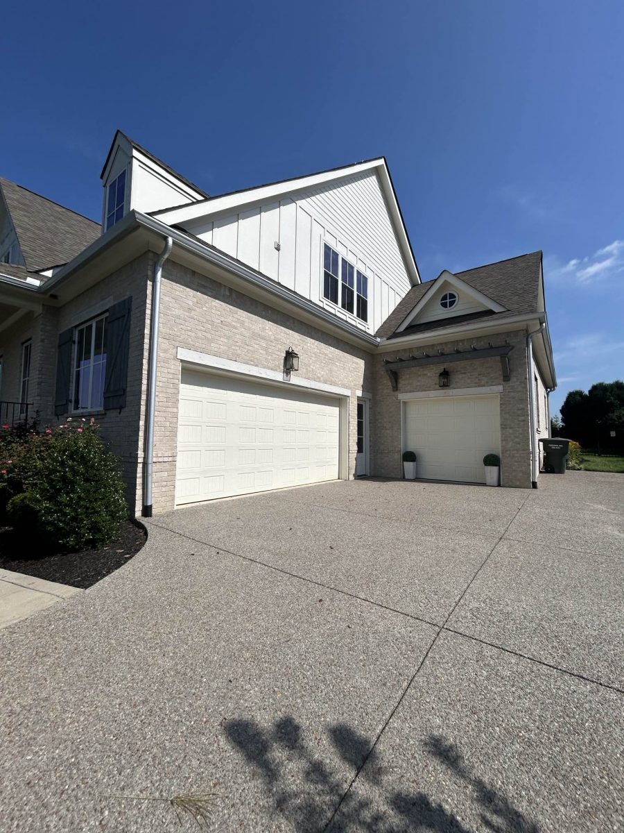 garage doors and driveway of brick home Preview Image 11