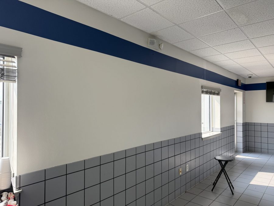 car dealership interior with blue stripe paint on upper wall Preview Image 4