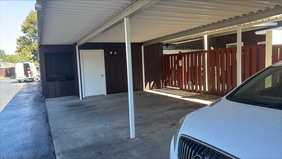 stained wood fencing surrounding covered parking area Preview Image 3