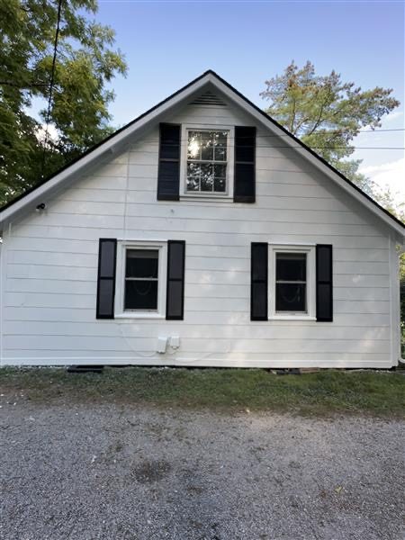 side of house with white siding and black shutters Preview Image 3