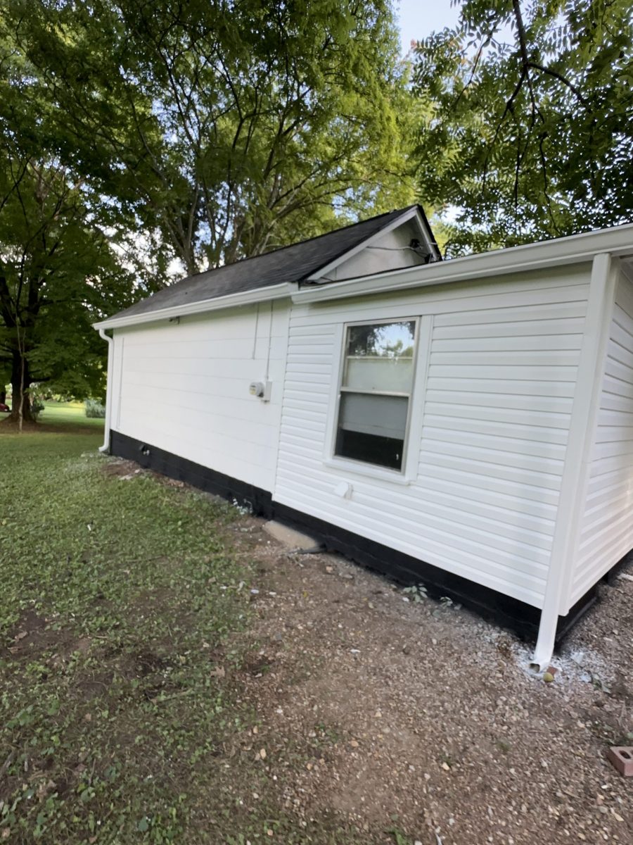 side of house with white siding and black shutters Preview Image 7