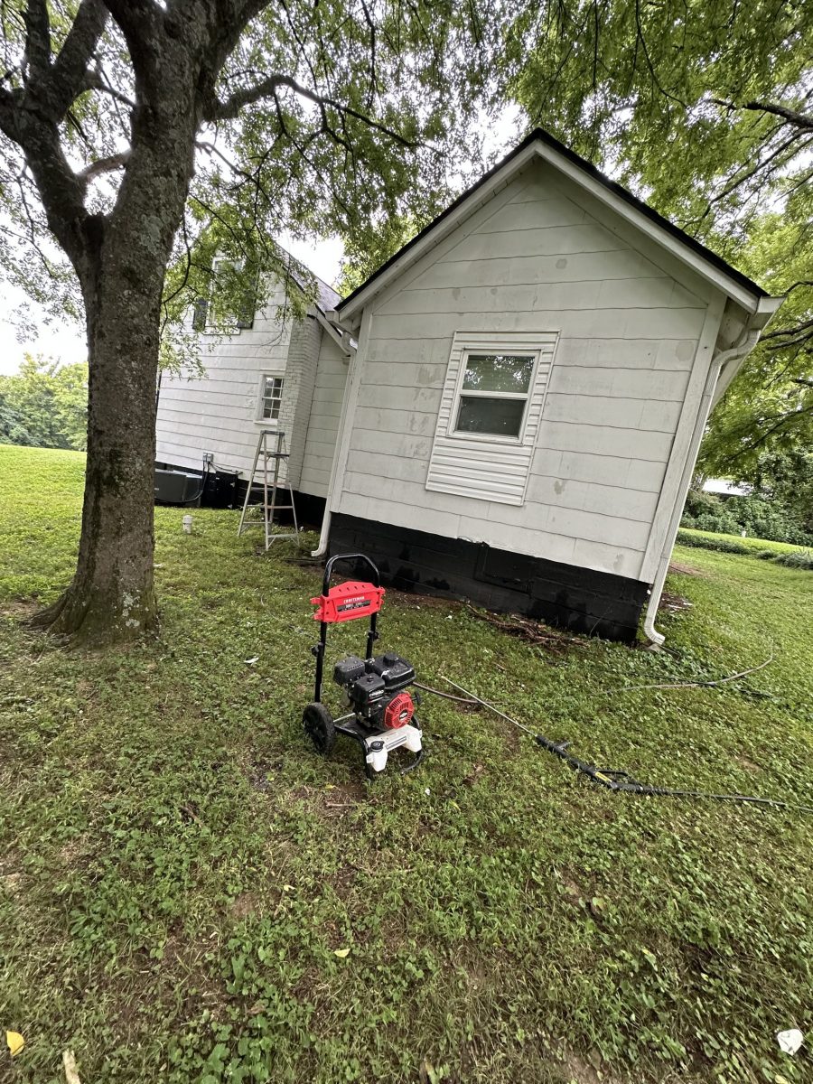 side of house with damaged white siding and black shutters Preview Image 15