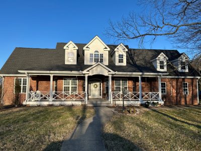 exterior of brick and painted siding house