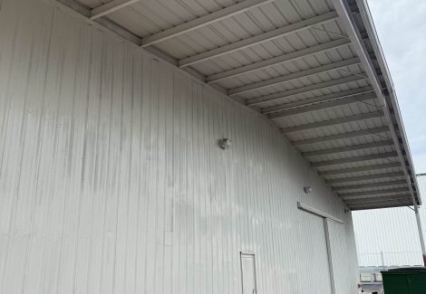 warehouse exterior with worn paint