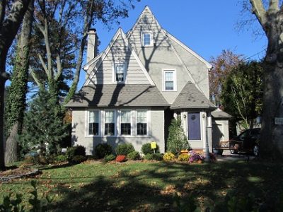 Exterior painting by CertaPro house painters in Mineola, NY