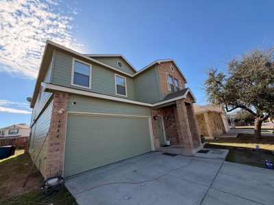 house exterior with painted siding and garage door