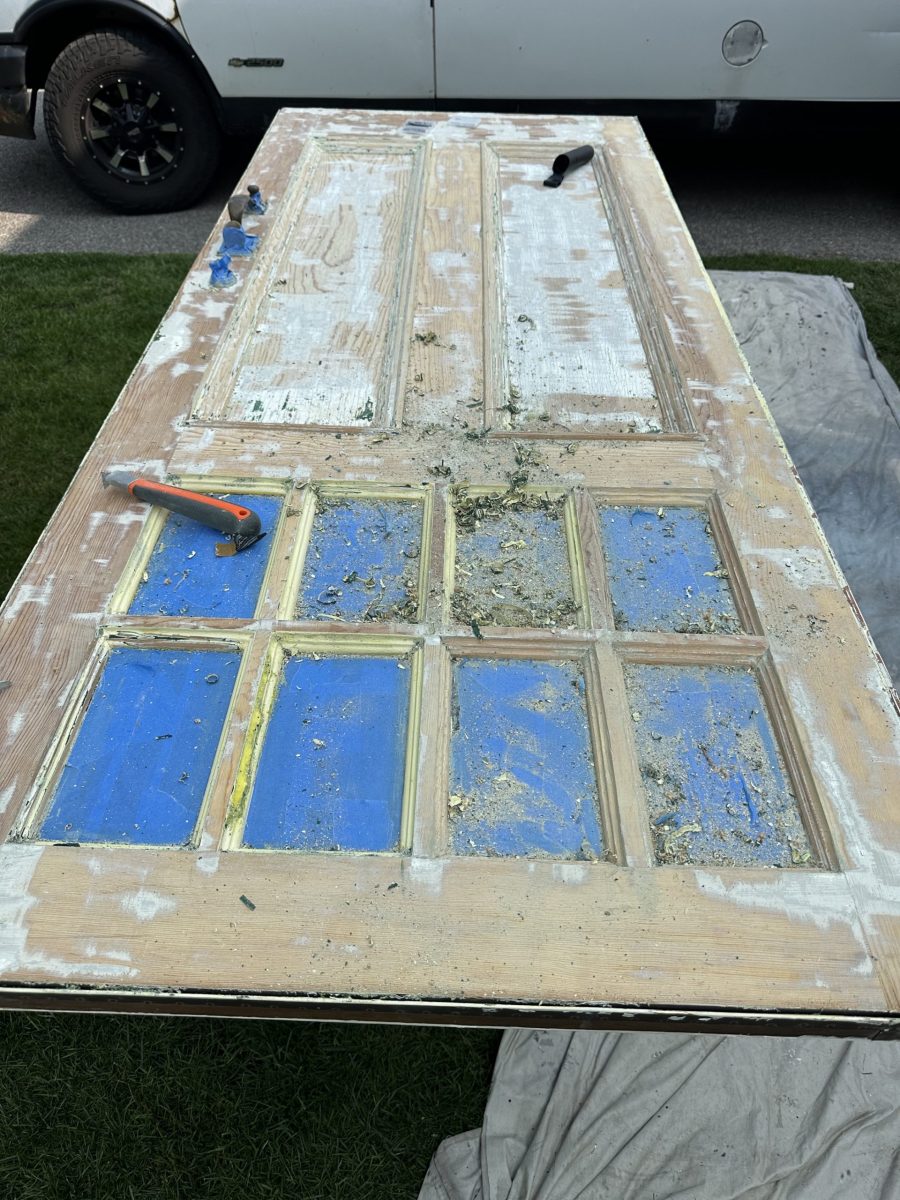 door in the process of being stained light brown in Needham, MA Preview Image 3