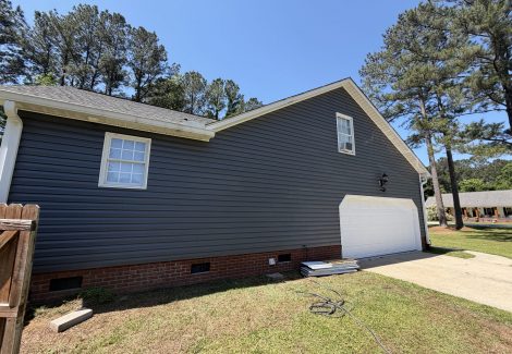 house exterior with painted dark siding