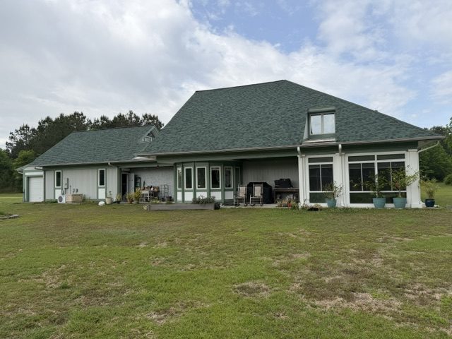 home exterior painted light sage green with darker green trim and accent areas Preview Image 7