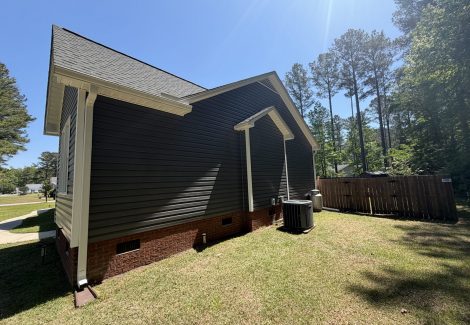 house exterior with painted dark siding